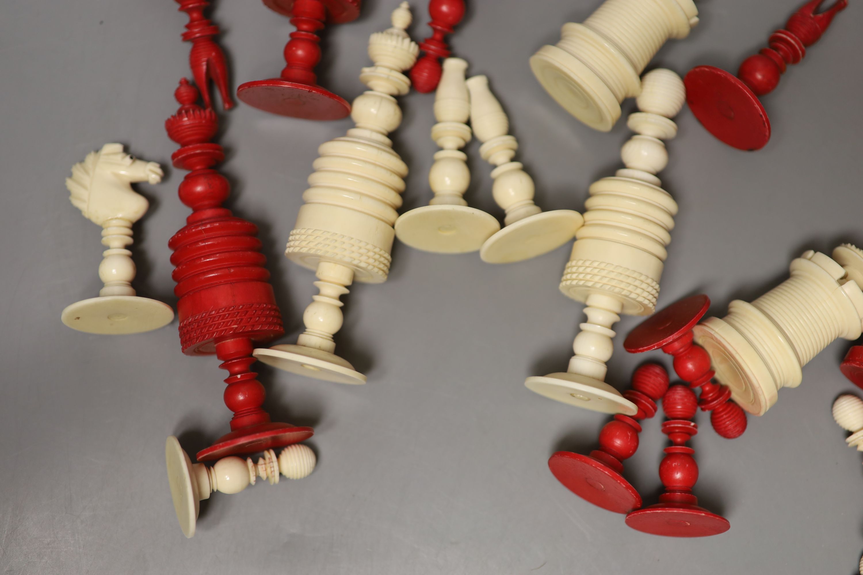 A 19th century natural and red stained bone chess set